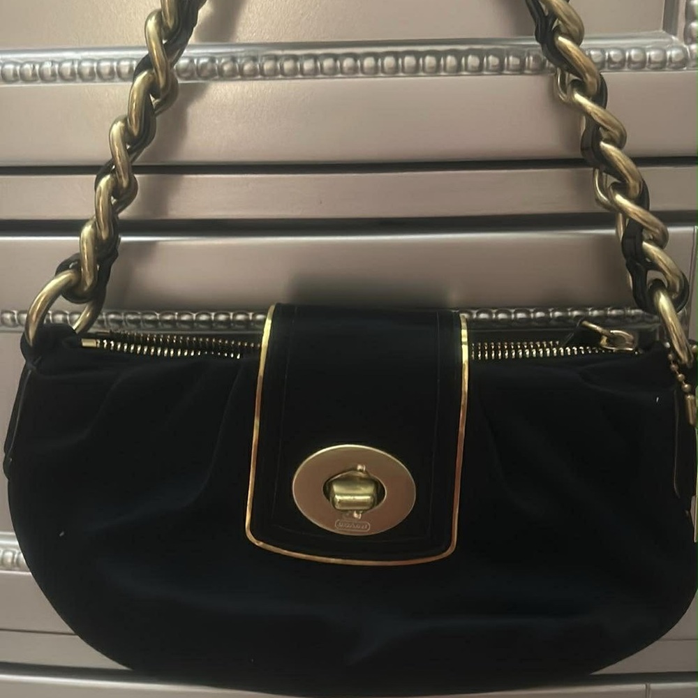 Elegant Black and Gold Coach Handbag